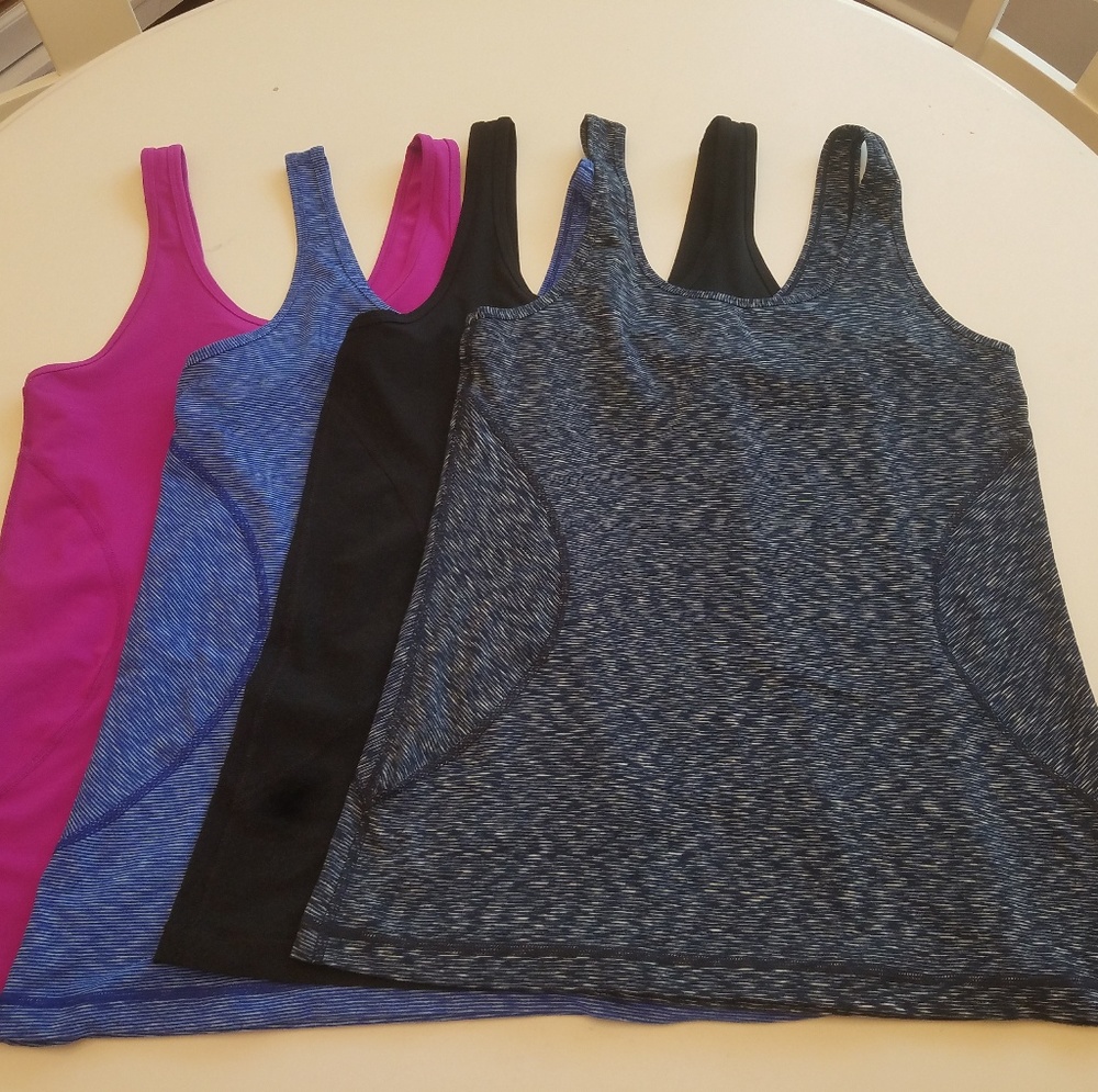 **Lot of FOUR amazing Zella tanks - size Large!!**